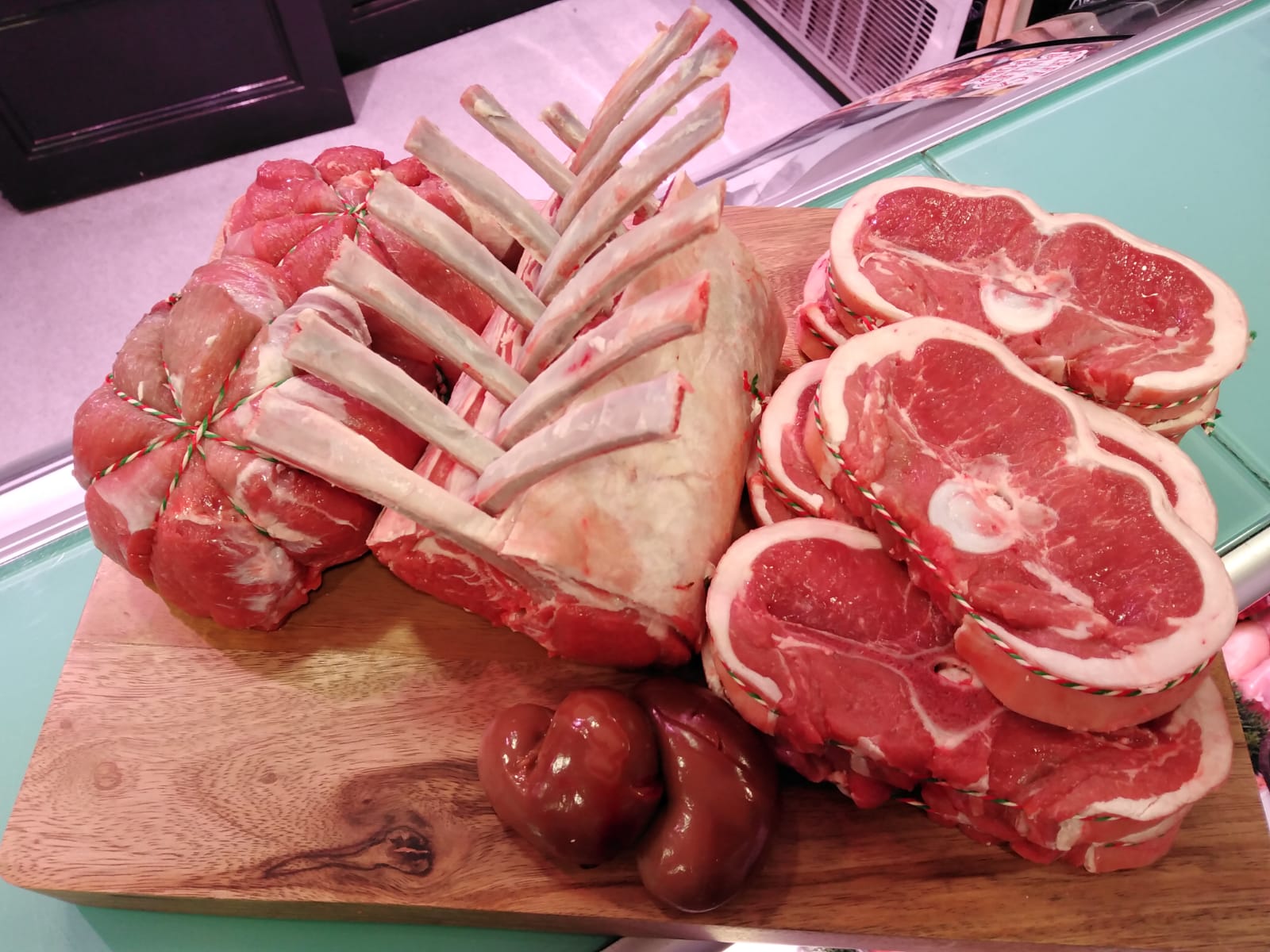 Rack of lamb, lamb chops and kidneys on a wooden board on the sage-green Chambers counter at 31 Front Street